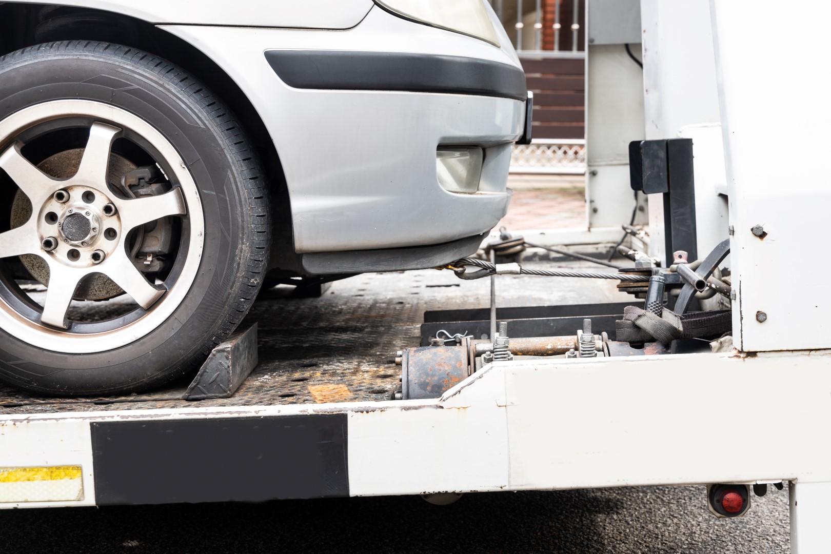 Car loaded on tow truck bed